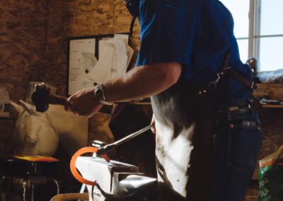 a man is working on an anvil